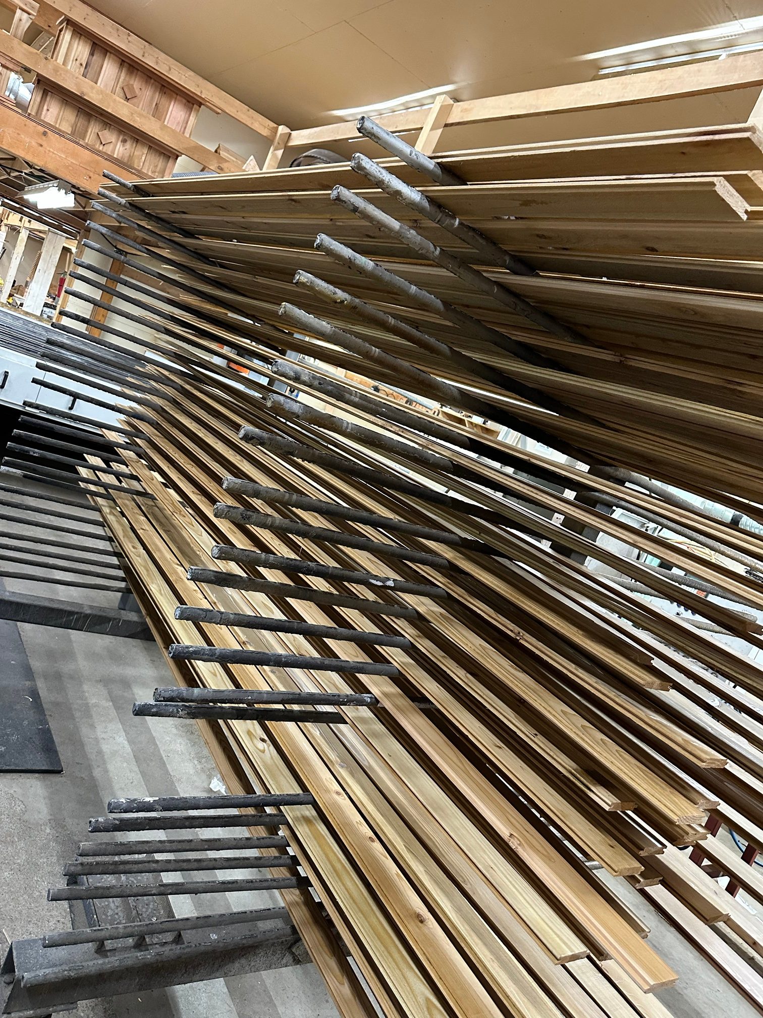 Profiled tongue-and-groove boards on a drying rack in the plant