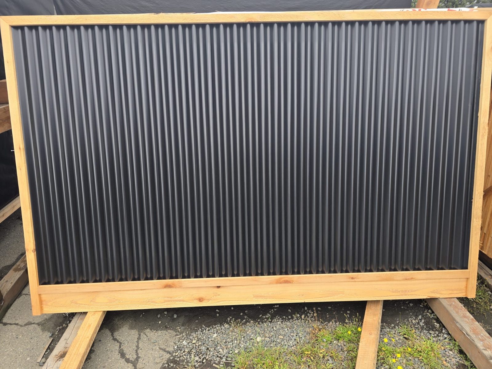 Full cedar-framed panel with black corrugated metal infill